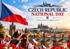 Czech Republic National Day 2026: History, Wishes & Messages Czech Republic National Day poster featuring the Czech flag, Prague Castle, Charles Bridge, historic architecture, and people celebrating in traditional clothing